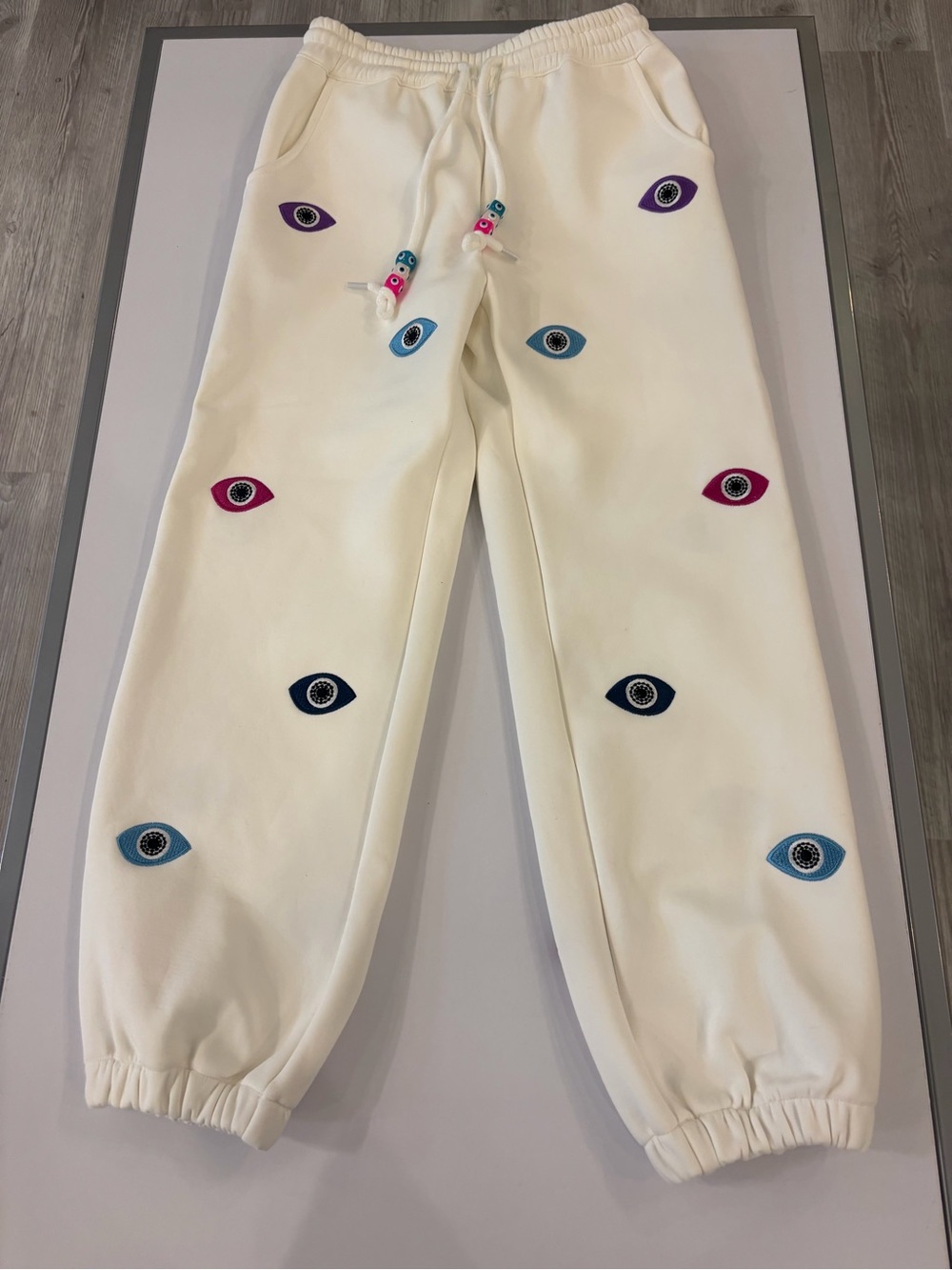 Lola and the boys Kids Cream Sweatpants with Multicolor Eye Patches